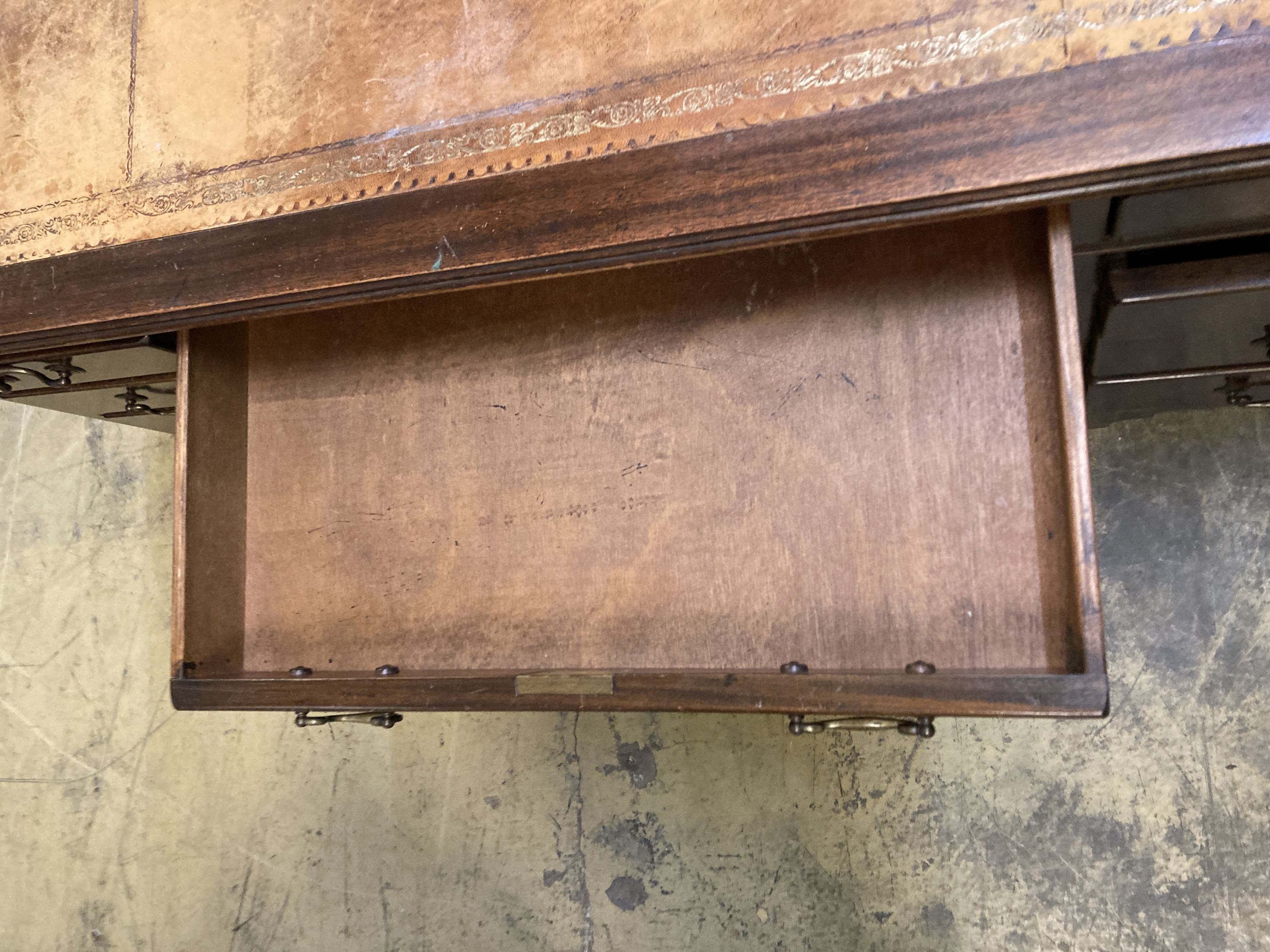 A reproduction mahogany pedestal desk, width 140cm, depth 76cm, height 78cm